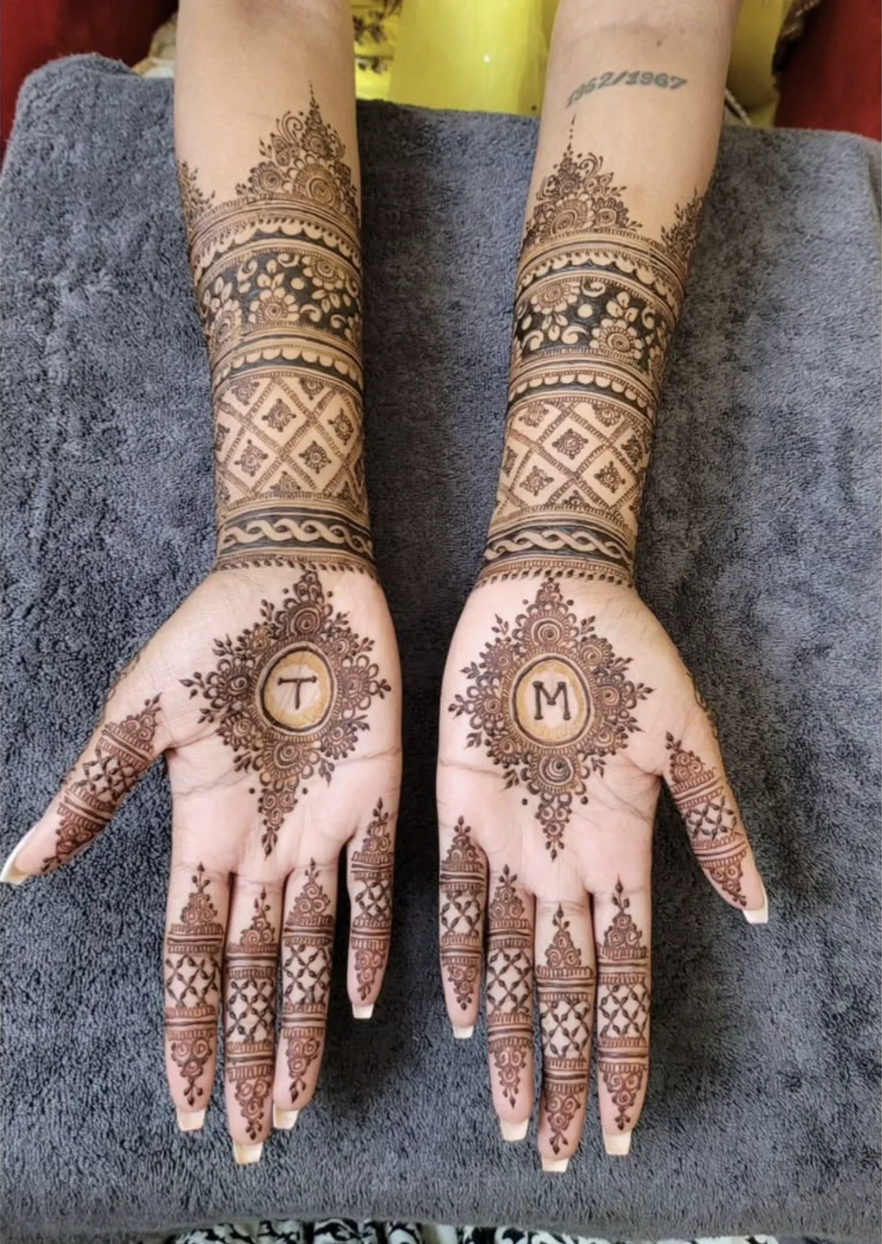 Henna celebration detail with finished mehndi artwork